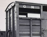 Black and white photograph of vacuum-fitted cattle wagon No. 2242.  Copyright L and GRP